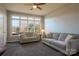 Sunroom with light gray sofas and large windows at 104 Fox Den Cir, Statesville, NC 28677