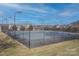 Well-maintained tennis court with surrounding fence at 104 Fox Den Cir, Statesville, NC 28677