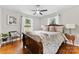 Comfortable bedroom with hardwood floors and a wooden bed frame at 1122 Penrose Ln, Charlotte, NC 28217