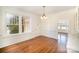 Spacious dining room with hardwood floors and access to other rooms at 1200 W Franklin St, Monroe, NC 28112