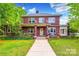 Brick house with front porch, steps, and landscaping at 1200 W Franklin St, Monroe, NC 28112