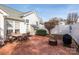 Brick patio with fire pit and grill at 12401 Olde Mill Stream Ct, Charlotte, NC 28277