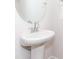 Small bathroom with pedestal sink, round mirror, and chrome faucet at 1334 31St St # 6, Conover, NC 28613