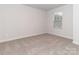 Well-lit bedroom with neutral walls and carpet at 1334 31St St # 6, Conover, NC 28613