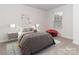 Virtually staged bedroom with bed and decor at 1334 31St St # 6, Conover, NC 28613