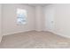 Bright bedroom with neutral walls and carpet at 1334 31St St # 6, Conover, NC 28613