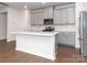 Modern kitchen with gray cabinets, stainless steel appliances, and an island at 1334 31St St # 6, Conover, NC 28613
