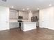 Modern kitchen featuring gray cabinets, stainless steel appliances, and an island at 1334 31St St # 6, Conover, NC 28613