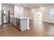 Spacious kitchen with island, stainless steel appliances and hardwood floors at 1334 31St St # 6, Conover, NC 28613