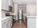 Modern kitchen with stainless steel appliances and gray cabinets at 1334 31St St # 6, Conover, NC 28613