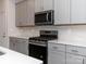Modern kitchen with gray cabinets, stainless steel appliances and white backsplash at 1334 31St St # 6, Conover, NC 28613