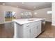 Open concept kitchen with island, white countertops and gray cabinets at 1334 31St St # 6, Conover, NC 28613