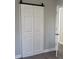 White double doors with a barn door style track at 1408 Delview Rd, Cherryville, NC 28021