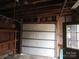 Spacious garage with overhead door and shelving at 1408 Delview Rd, Cherryville, NC 28021