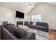 Living room with vaulted ceiling, fireplace and hardwood floors at 1409 Griers Grove Rd, Charlotte, NC 28216