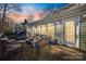 Evening view of deck with seating area and fire pit at 2702 Oxborough Dr, Matthews, NC 28105