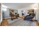 Bright home office with hardwood floors, a large desk, and a massage chair at 2702 Oxborough Dr, Matthews, NC 28105