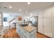 Spacious kitchen with island, stainless steel appliances, and hardwood floors at 2702 Oxborough Dr, Matthews, NC 28105