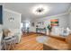 Open living space with hardwood floors, neutral decor, and a view of dining area at 2702 Oxborough Dr, Matthews, NC 28105