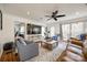 Relaxing living room with hardwood floors, leather sofas, and a large TV at 2702 Oxborough Dr, Matthews, NC 28105