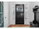 Black front door with sidelights and decorative glass at 304 Haney St, China Grove, NC 28023