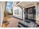 Black front door with sidelights, steps, and gravel path at 304 Haney St, China Grove, NC 28023