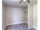 Bright bedroom with wood-look floors, ceiling fan, and closet at 40049 Nc 740 Hwy, New London, NC 28127