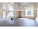 Bright living room featuring hardwood floors, multiple windows, and a ceiling fan at 40049 Nc 740 Hwy, New London, NC 28127