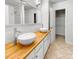 Bathroom featuring a double vanity and mirror, with tile flooring at 4818 Whistling Oak Ct, Charlotte, NC 28269