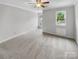Spacious bedroom with neutral carpet, ceiling fan, and natural light from windows at 4818 Whistling Oak Ct, Charlotte, NC 28269