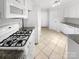 Bright kitchen featuring white appliances, granite countertops, and tile flooring at 4818 Whistling Oak Ct, Charlotte, NC 28269