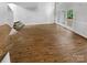 Living room with hardwood floors, French doors leading to back patio, and breakfast bar at 4818 Whistling Oak Ct, Charlotte, NC 28269