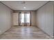 Spacious bedroom with wood-look floors and large window at 5719 Clintwood Dr, Stanley, NC 28164