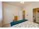 Bedroom with full-size bed and access to a bathroom at 5998 Village Nw Dr, Concord, NC 28027