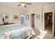 Bright bedroom with a queen-size bed and ensuite bathroom access at 5998 Village Nw Dr, Concord, NC 28027