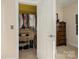 Walk-in closet with ample shelving and hanging space at 5998 Village Nw Dr, Concord, NC 28027