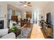 Bright and spacious living room with hardwood floors and a fireplace at 5998 Village Nw Dr, Concord, NC 28027
