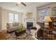 Living room with fireplace, hardwood floors, and French doors at 5998 Village Nw Dr, Concord, NC 28027