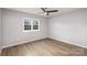 Spacious bedroom with ceiling fan and hardwood floors at 6130 Heath Ridge Ct, Charlotte, NC 28210