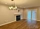 Bright dining room with hardwood floors and a modern chandelier at 6130 Heath Ridge Ct, Charlotte, NC 28210