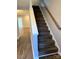 Modern staircase with wood-look flooring at 6130 Heath Ridge Ct, Charlotte, NC 28210