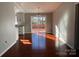 Bright dining room with hardwood floors and sliding glass doors to deck at 7810 Heatherdale Ct, Charlotte, NC 28212