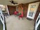 Relaxing screened porch with brick flooring and seating at 8423 Quail Hollow Dr, Harrisburg, NC 28075