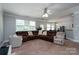 Spacious living room with sectional sofa and view into dining area at 8505 Delamere Ln, Charlotte, NC 28269