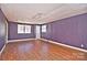 Simple basement room with wood floors and purple walls at 936 23Rd Ne Ave, Hickory, NC 28601