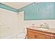 Clean bathroom with tiled walls and granite countertop at 936 23Rd Ne Ave, Hickory, NC 28601