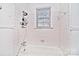 Simple bathroom with shower/tub combo and window at 936 23Rd Ne Ave, Hickory, NC 28601