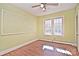 Bright bedroom with wood flooring, large window, and pegboard accent wall at 936 23Rd Ne Ave, Hickory, NC 28601