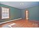 Charming bedroom with wood flooring, window, and a view of the backyard at 936 23Rd Ne Ave, Hickory, NC 28601