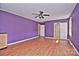 Large bedroom with wood floors, ceiling fan and purple walls at 936 23Rd Ne Ave, Hickory, NC 28601